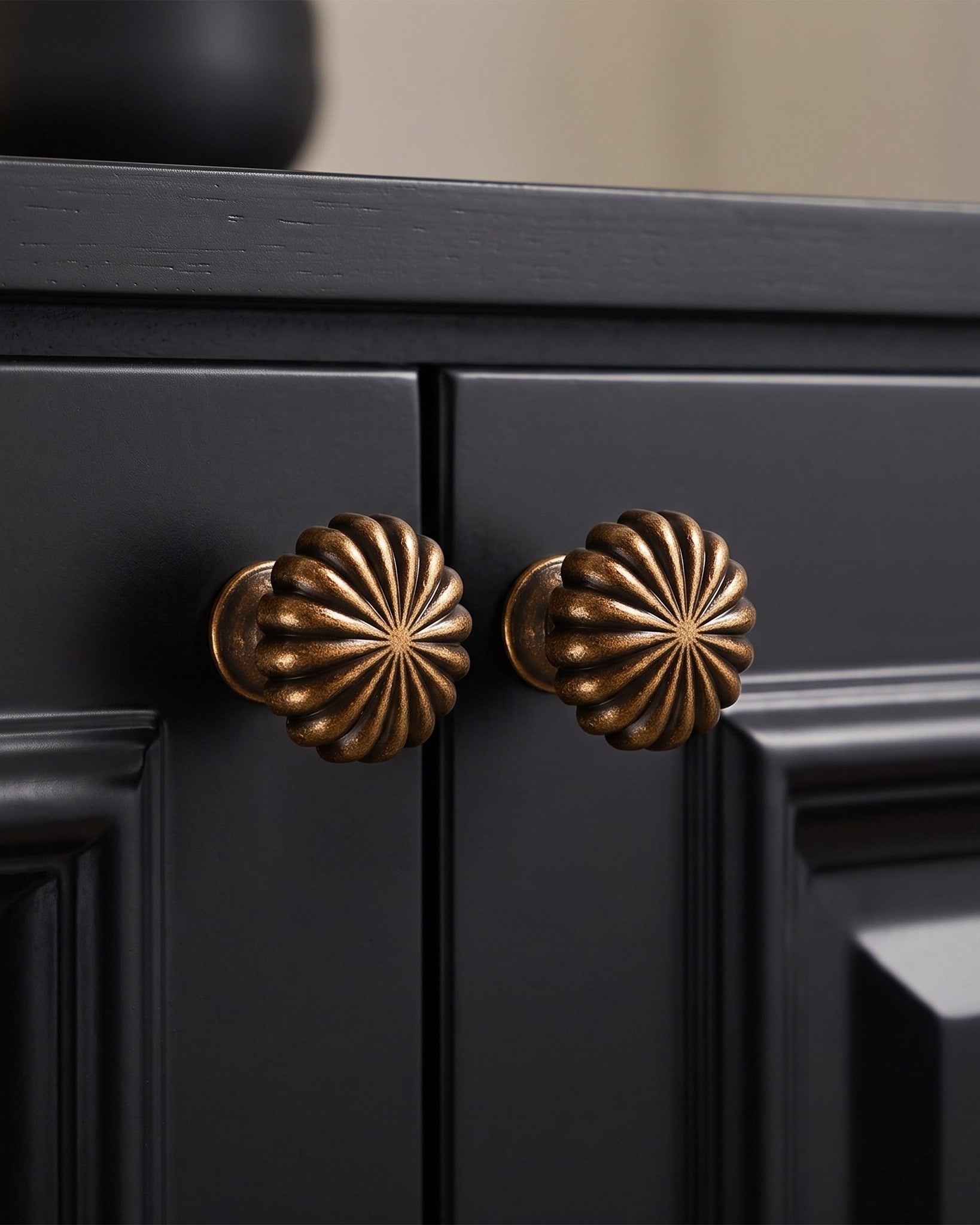 The Solano Ribbed Antique Brass Cabinet Knob
